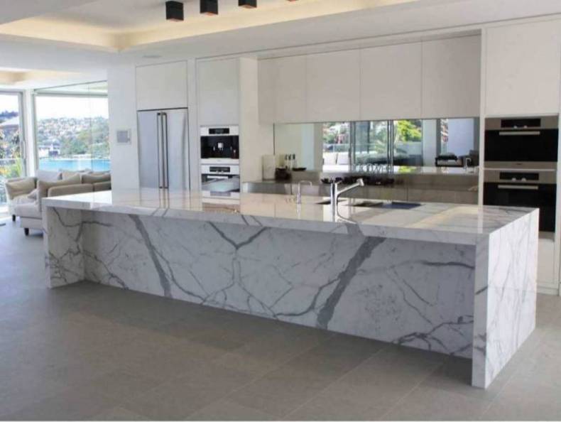 Calcutta Marble Countertops In A Modern White Kitchen Remodeling